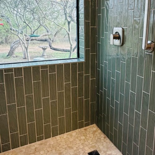 Stylish shower installation with green tiles in Corpus Christi
